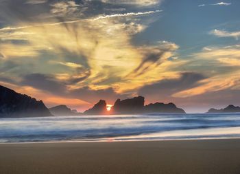 Scenic view of sea against sky during sunset