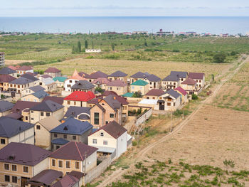 High angle view of houses and buildings in city