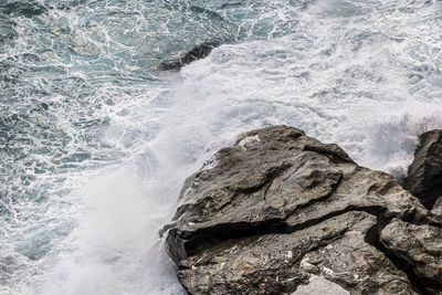 Sea waves splashing on rocks