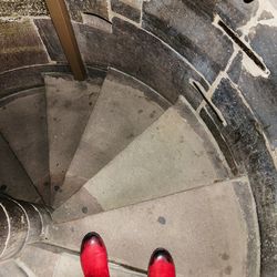 Low section of woman standing on tiled floor