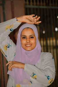 Portrait of smiling young woman in traditional clothing