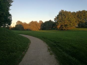 Scenic view of green landscape against clear sky