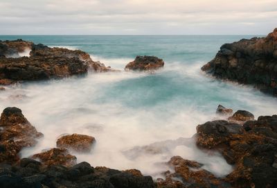 Dramatic rocky coastal seascape scenery at charco del palo, lanzerote, canary islands