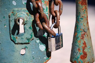 Close-up of padlocks on metal chain