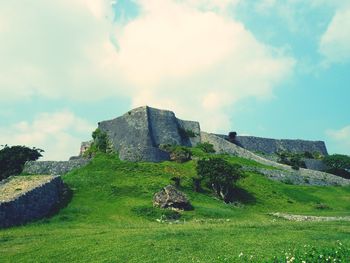 Castle on mountain against sky