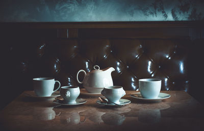 Close-up of coffee cups on table