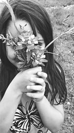 Close-up of hand holding flower