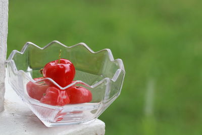 Close-up of strawberries in glass bowl on table