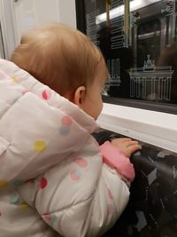 Close-up of cute baby girl at home