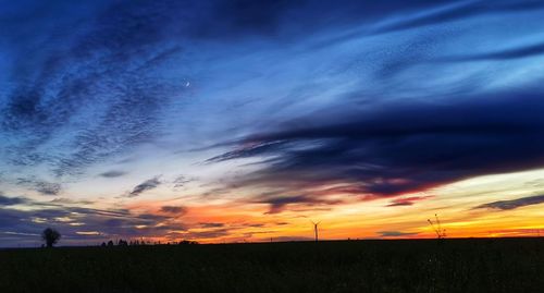 Scenic view of dramatic sky over land