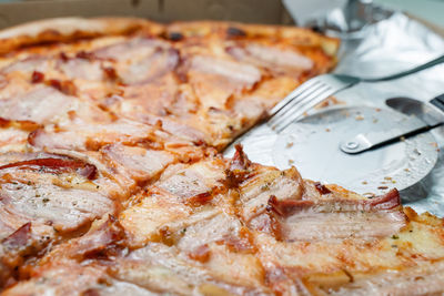 Close-up of pizza in plate on table