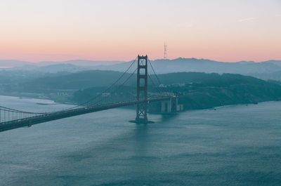 Scenic view of bridge against sky during sunset