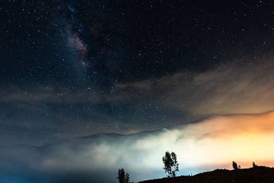 Low angle view of clouds and sky at night