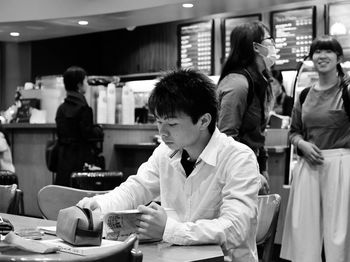 Woman sitting in restaurant