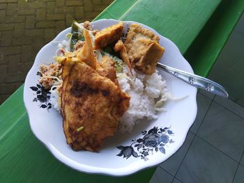 Indonesian traditional food, consisting of rice, salted fish, sprouts, and various other vegetables.