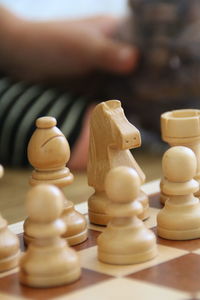 Close-up of chess pieces on table