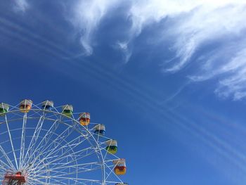 Low angle view of ferris wheel against sky