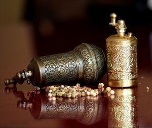 Close-up of food and grinders on table