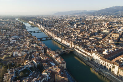 Aerial view of florence along the arno river and the old town from above, tuscany, italy,