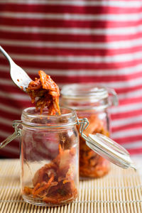 Close-up of drink in glass jar on table