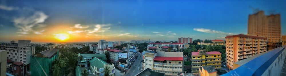 High angle view of buildings against sky at sunset