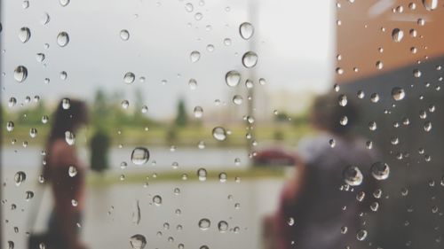 Full frame shot of wet glass window in rainy season