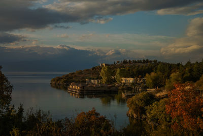 Scenic view of lake against cloudy sky