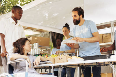 Side view of man working at table