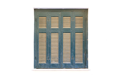 Close-up of closed window on white wall