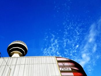 Low angle view of building against blue sky