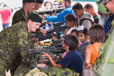 Group of people looking at food outdoors