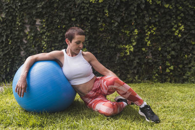 Woman training and stretching outdoors