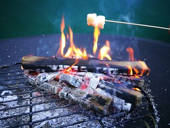 Marshmallows being roasted on barbecue grill