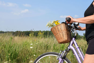 Man riding bicycle on field