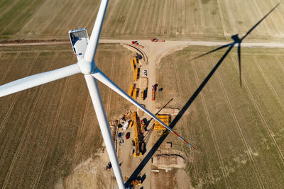 Construction site near windmill turbine, wind generator installing