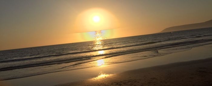 Scenic view of sea at sunset