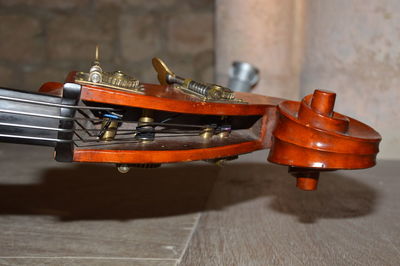 Close-up of string instrument on table