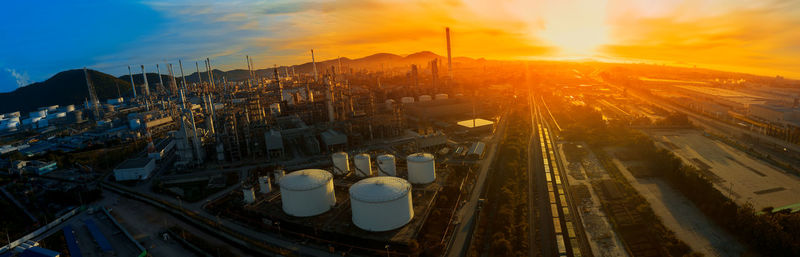High angle view of illuminated buildings against sky during sunset
