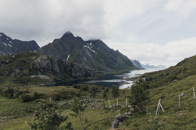 Scenic view of landscape and mountains against sky