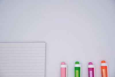 Close-up of colored pencils against white background