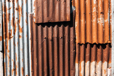 Old and rusty zinc sheet wall. vintage style metal sheet roof texture. pattern of old metal sheet. 