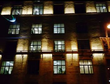 Illuminated building seen through window