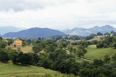 Scenic view of landscape and mountains against sky