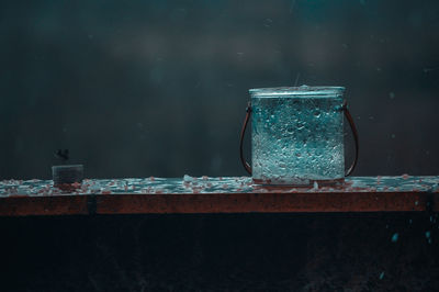 Close-up of water in jar on table