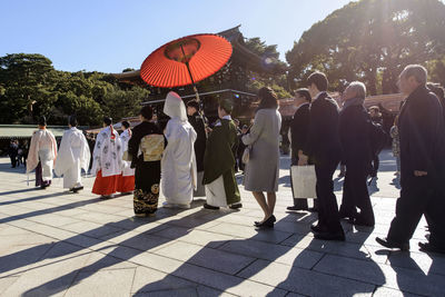 People in traditional clothing against sky