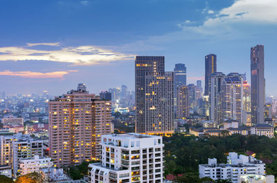 Modern buildings in city against sky