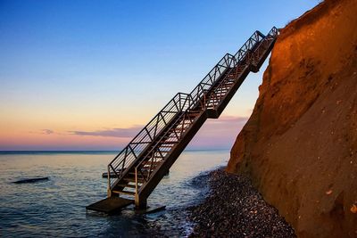 Steps leading into sea from a cliff