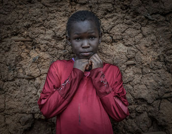 Portrait of young man standing on rock