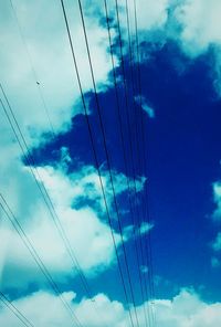 Low angle view of electricity pylon against sky