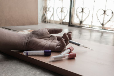 Close-up of hand holding cigarette